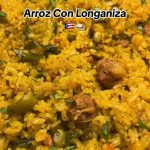 Spanish rice with longaniza - a delicious one pot meal made with thinly sliced longaniza, bell peppers, onions, garlic, and aromatic seasonings.