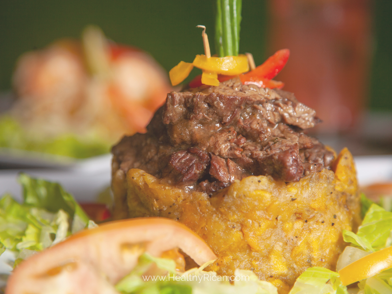 A detailed illustration depicting the historical evolution of Mofongo, a traditional Puerto Rican dish, featuring its key ingredients and cultural significance.